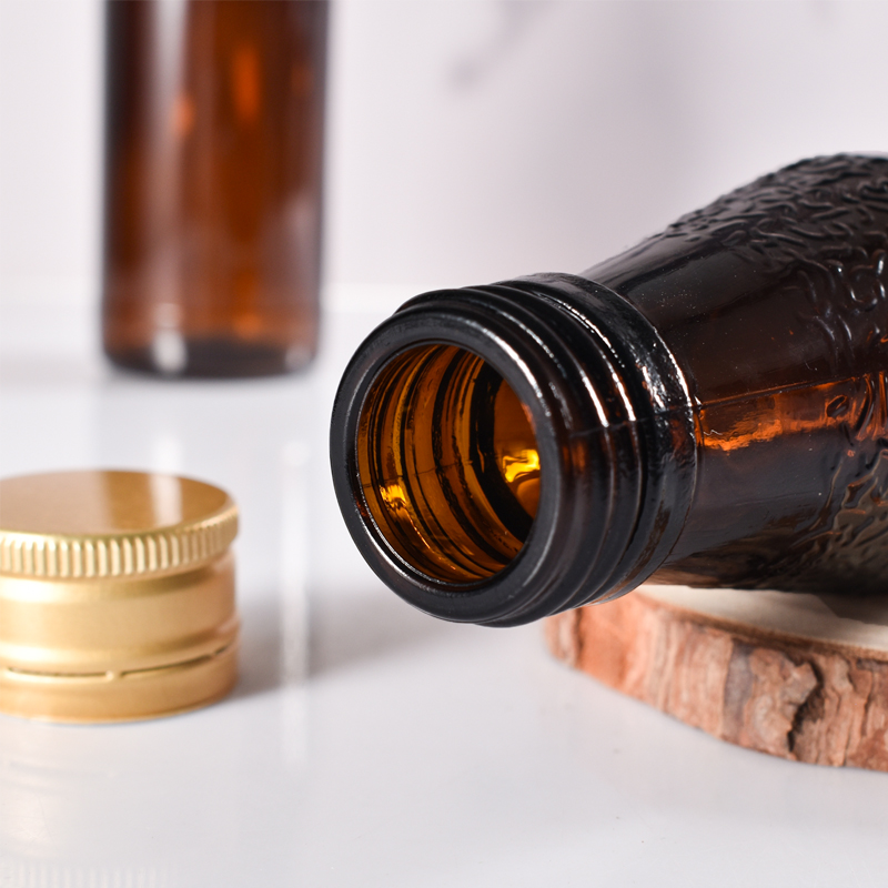 الشركة المصنعة 100 مل من الزجاج المختوم لإعادة تدوير زجاجات شراب زجاج العنبر مع غطاء معدني