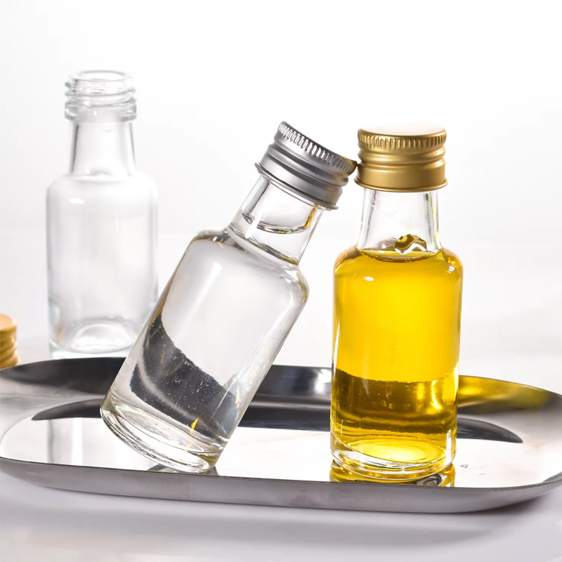 زجاجات الخمور الزجاجية الصغيرة ذات الأغطية