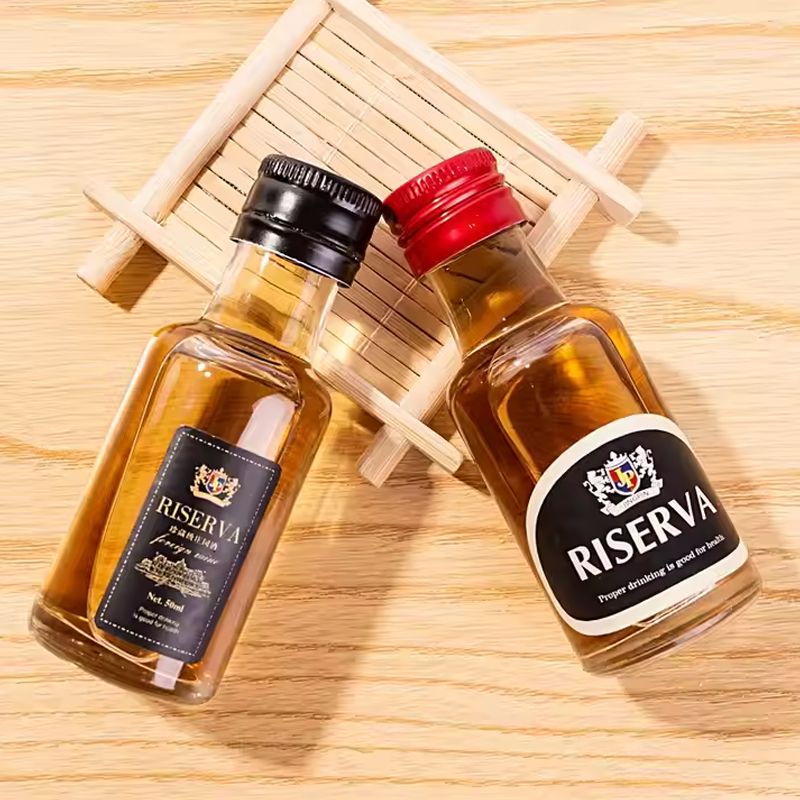 زجاجات الخمور الزجاجية الصغيرة ذات الأغطية